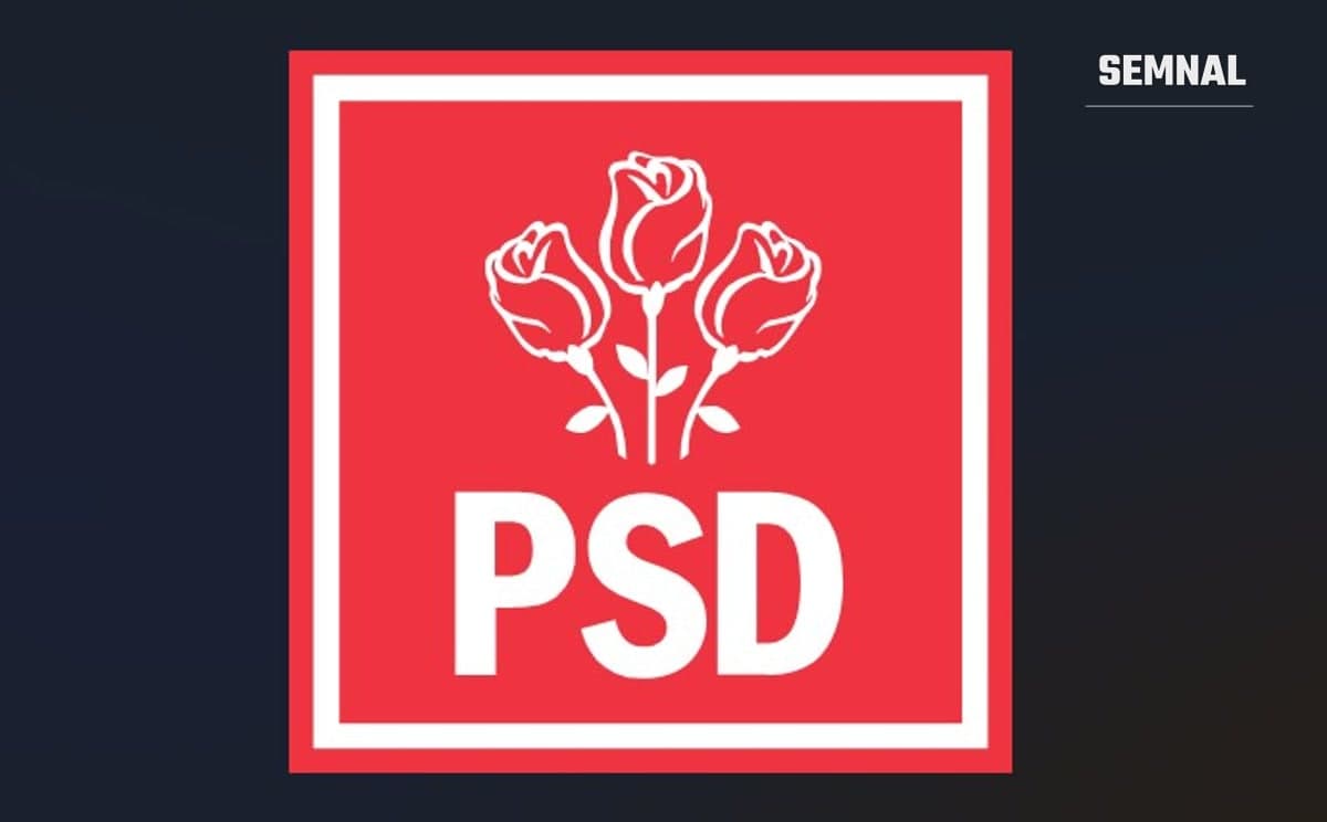 In imagine este sigla PSD. Trei trandafiri pe fond roșu.