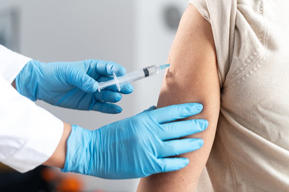 Close Up,hands,of,the,doctor,wearing,protective,gloves,giving,a