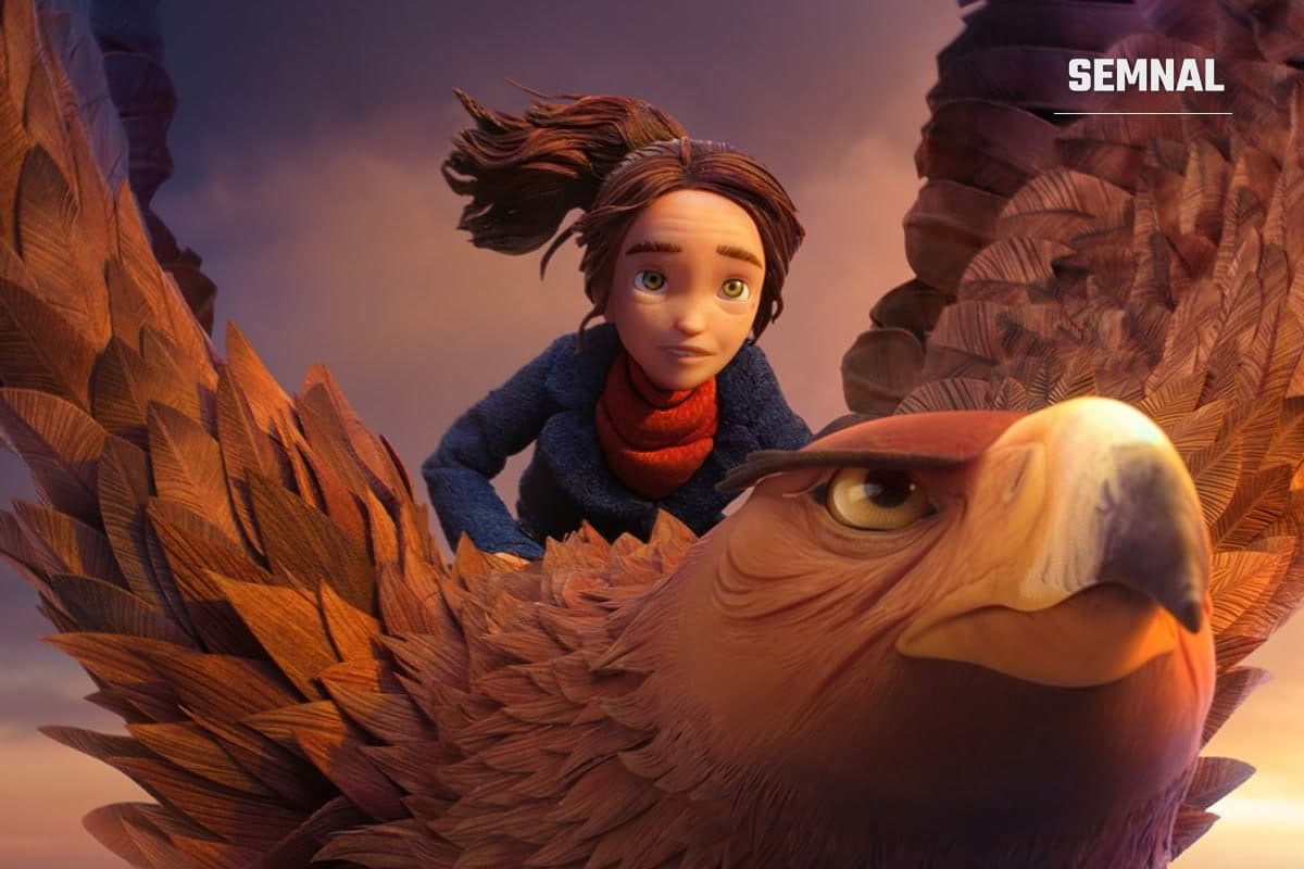 Fetiță cu fular roșu zburând pe spatele unui vultur uriaș cu pene arămii, în animația stop-motion Wildwood: Tărâmul fantastic