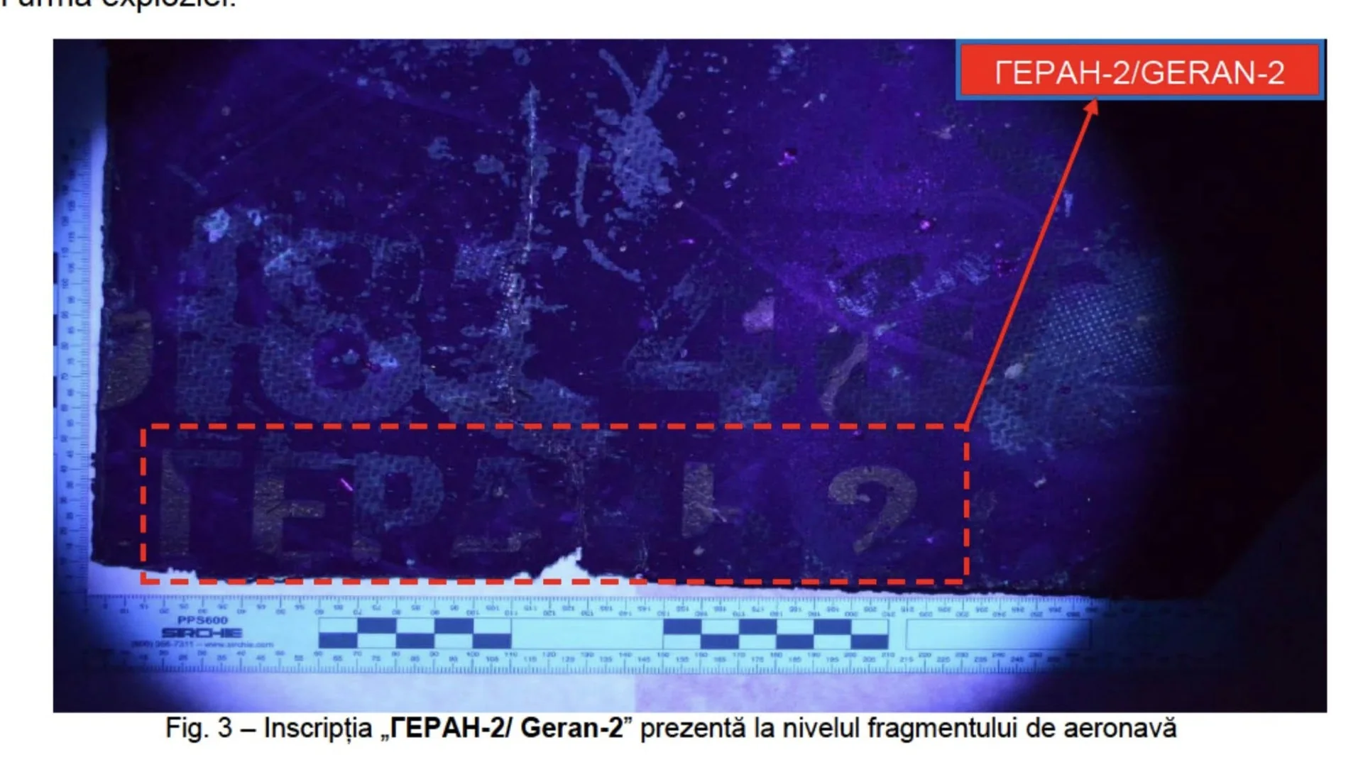 Fragment de dronă cu inscripția GERAN-2 analizat științific, marcat cu linii roșii și scară de măsurare pentru investigație tehnică.